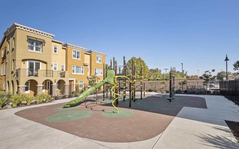 Prima Homeowners Association playground with building in background